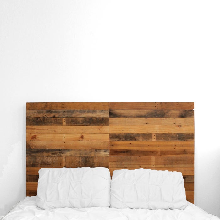 Pallet headboard above bed 