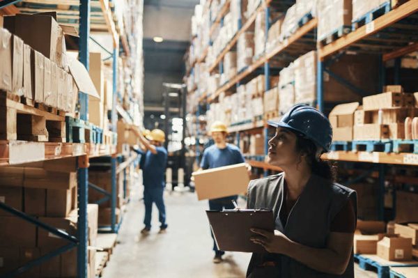 Close up of a group of workers working in a warehouse