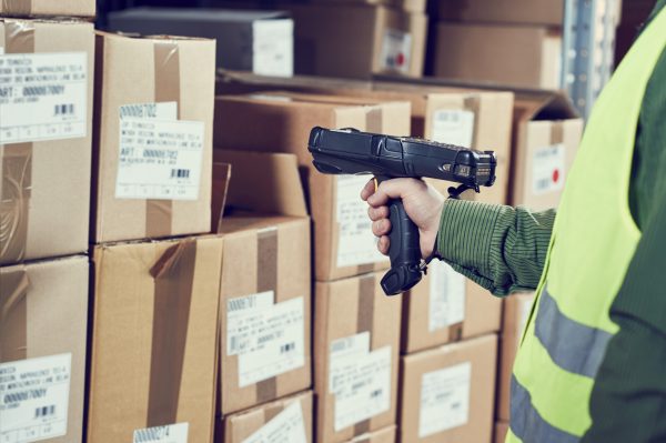warehouseman worker using wireless barcode scanner