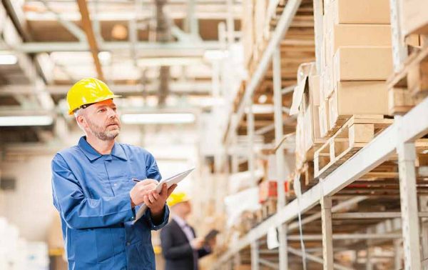 a man checking inventory at a warehouse