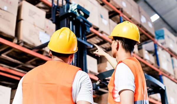 two men inspecting a warehouse